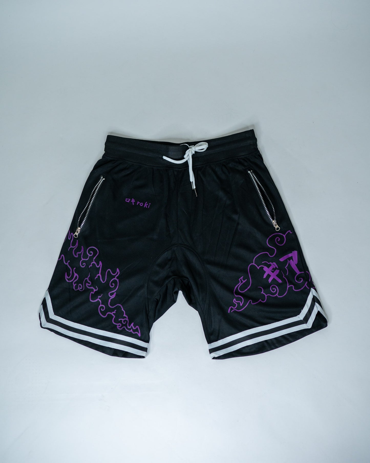 Front view of black Roki Awakened gym shorts featuring purple accents and Roki logo