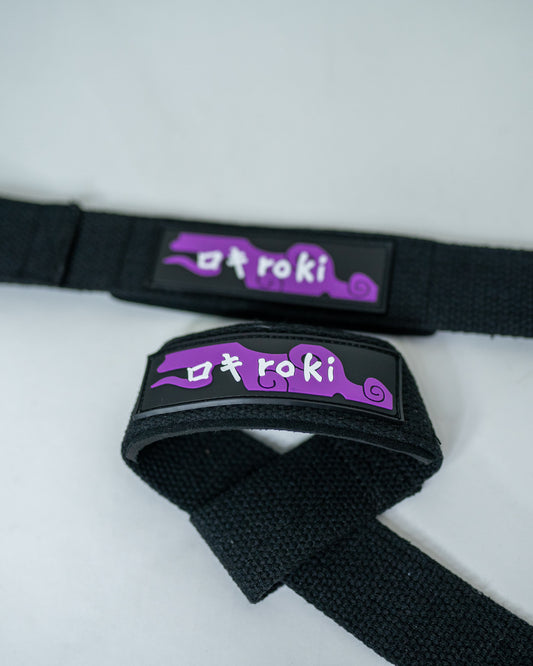 Close-up of black Roki fruit lifting straps featuring purple accents