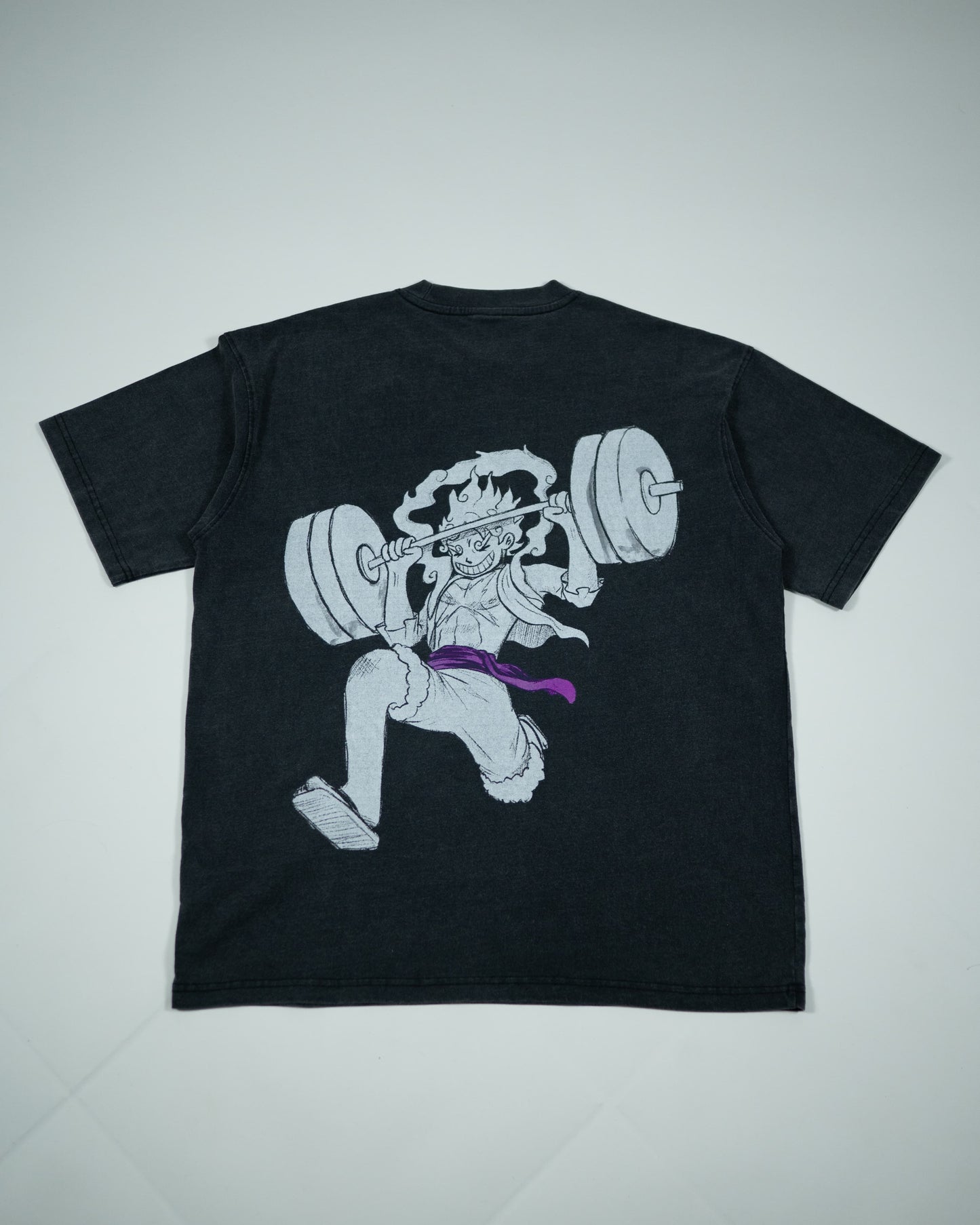 Back view of a black Roki muki muki oversized t-shirt featuring a manga-inspired design