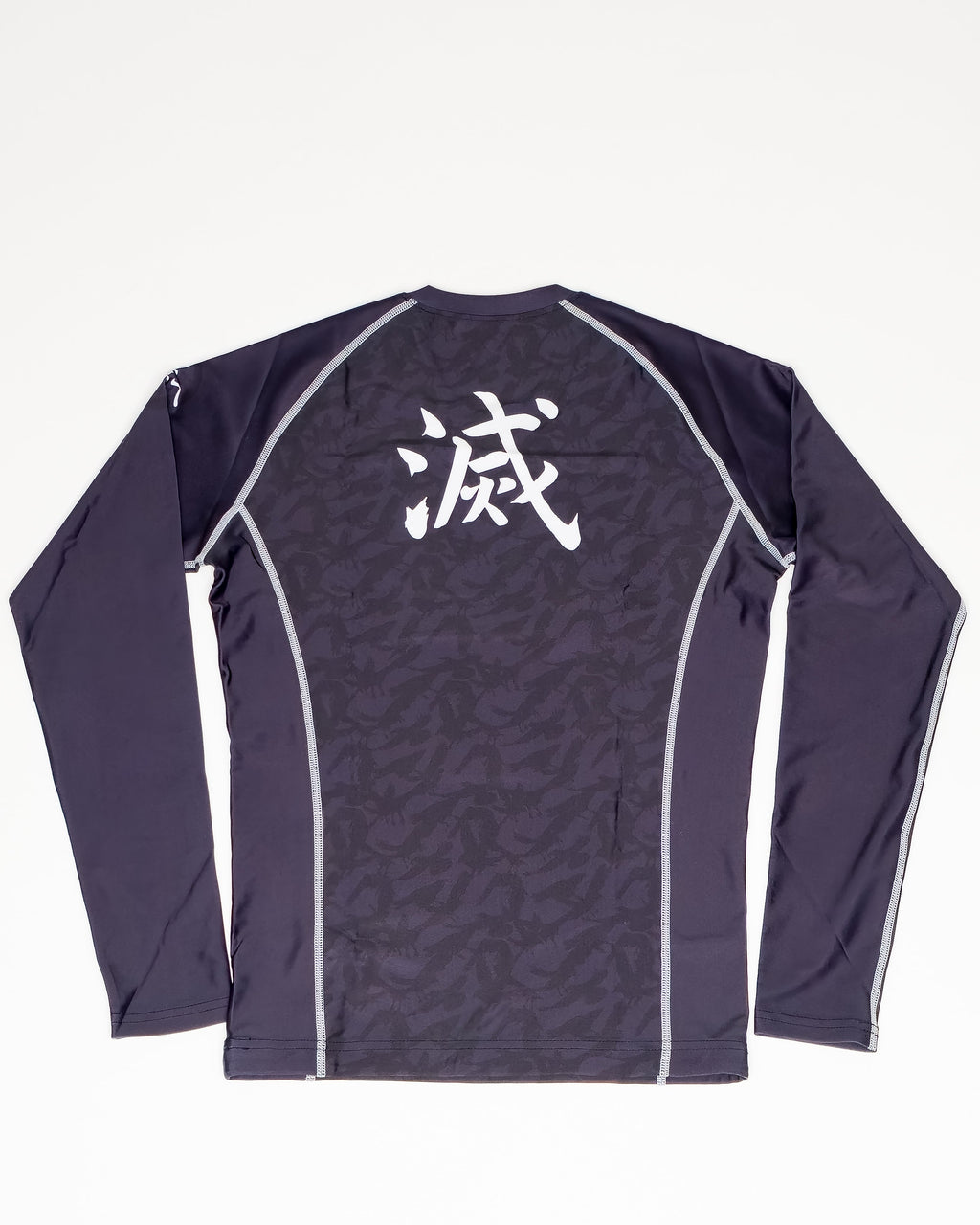 Black long sleeve demon slayer mma rash guard shirt with white text on a white background