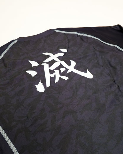 Black crow rash guard closeup with white text on a white background