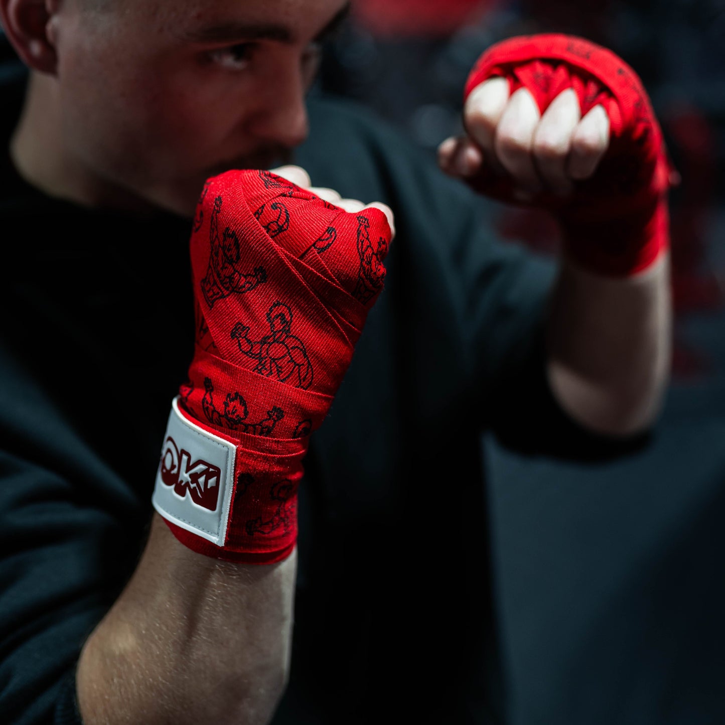 Close-up of athlete wearing Baki anime boxing hand wraps