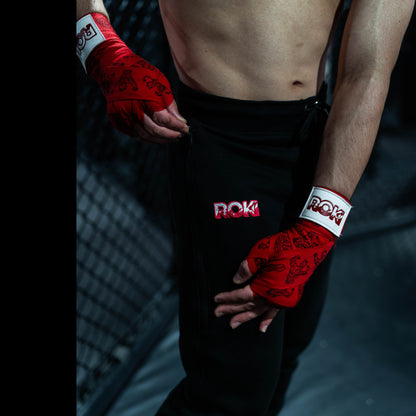 Close-up of Baki anime hand wraps and joggers