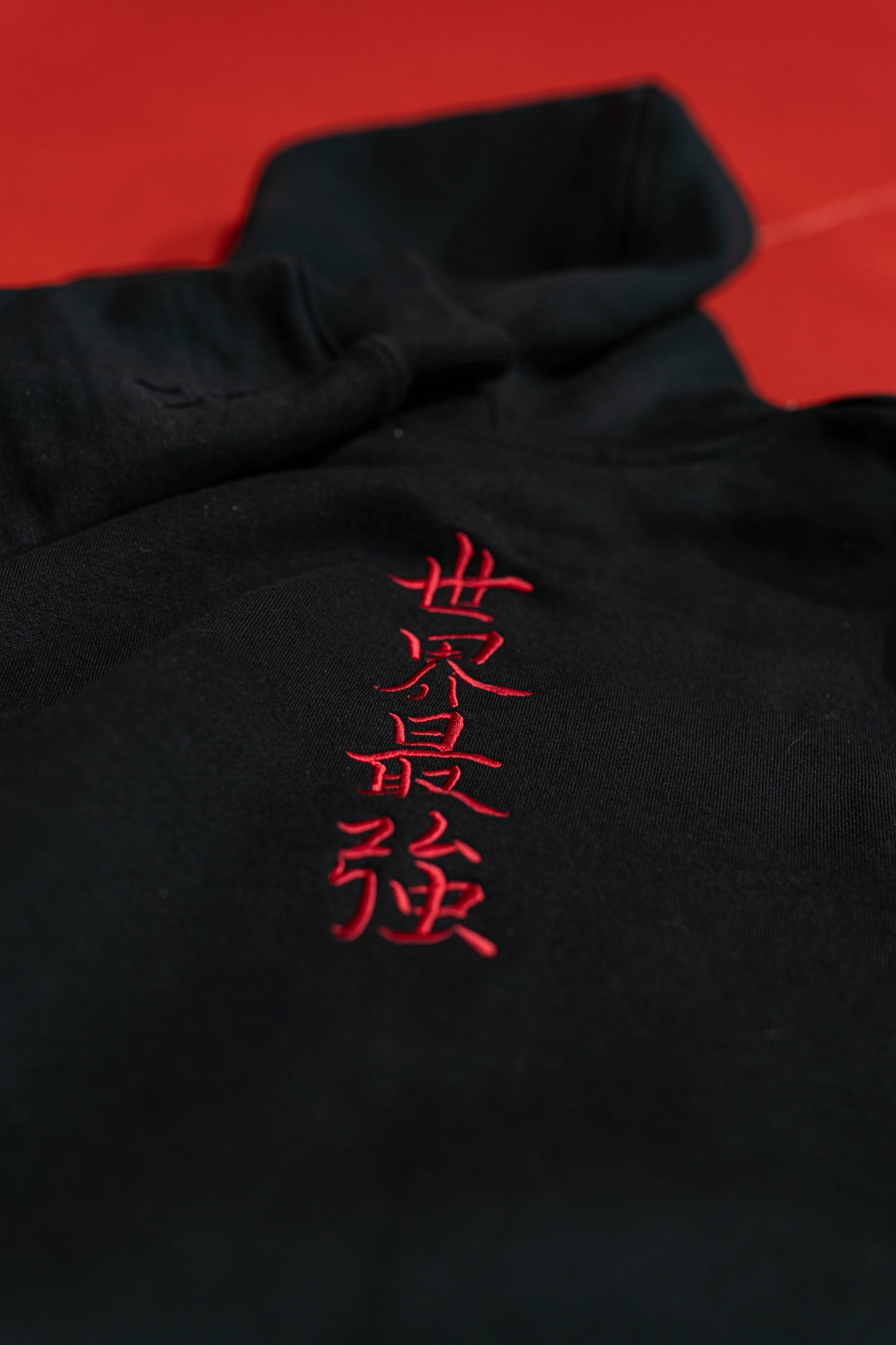 Close-up of black Baki anime gym hoodie