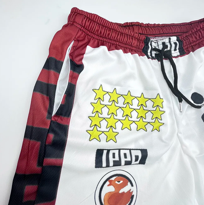 Close-up of red and white Hajime No Ippo boxing shorts