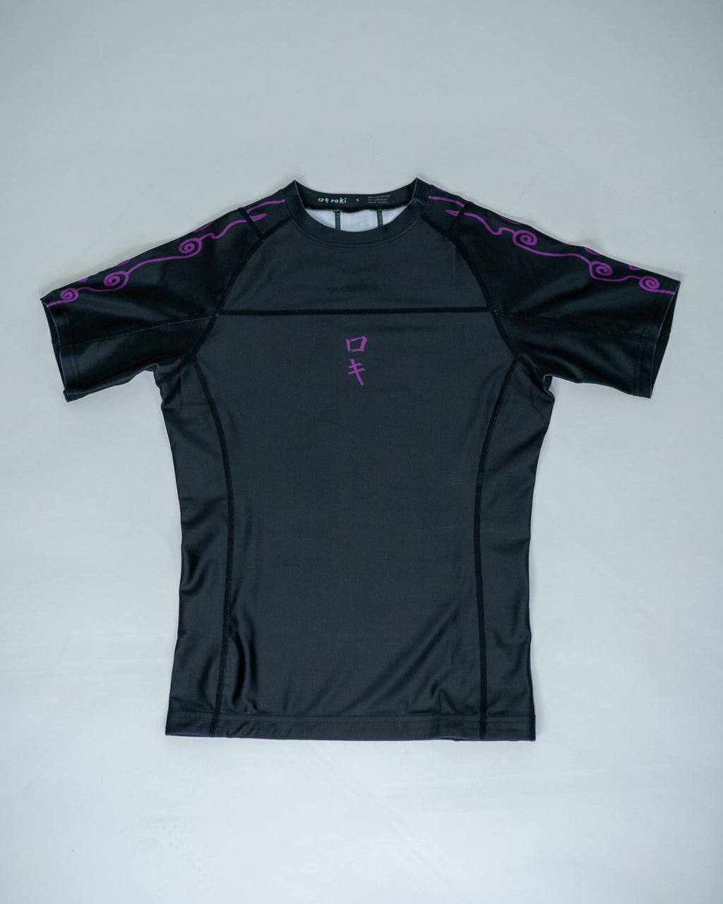 Front view of a black Roki Awakened compression shirt
