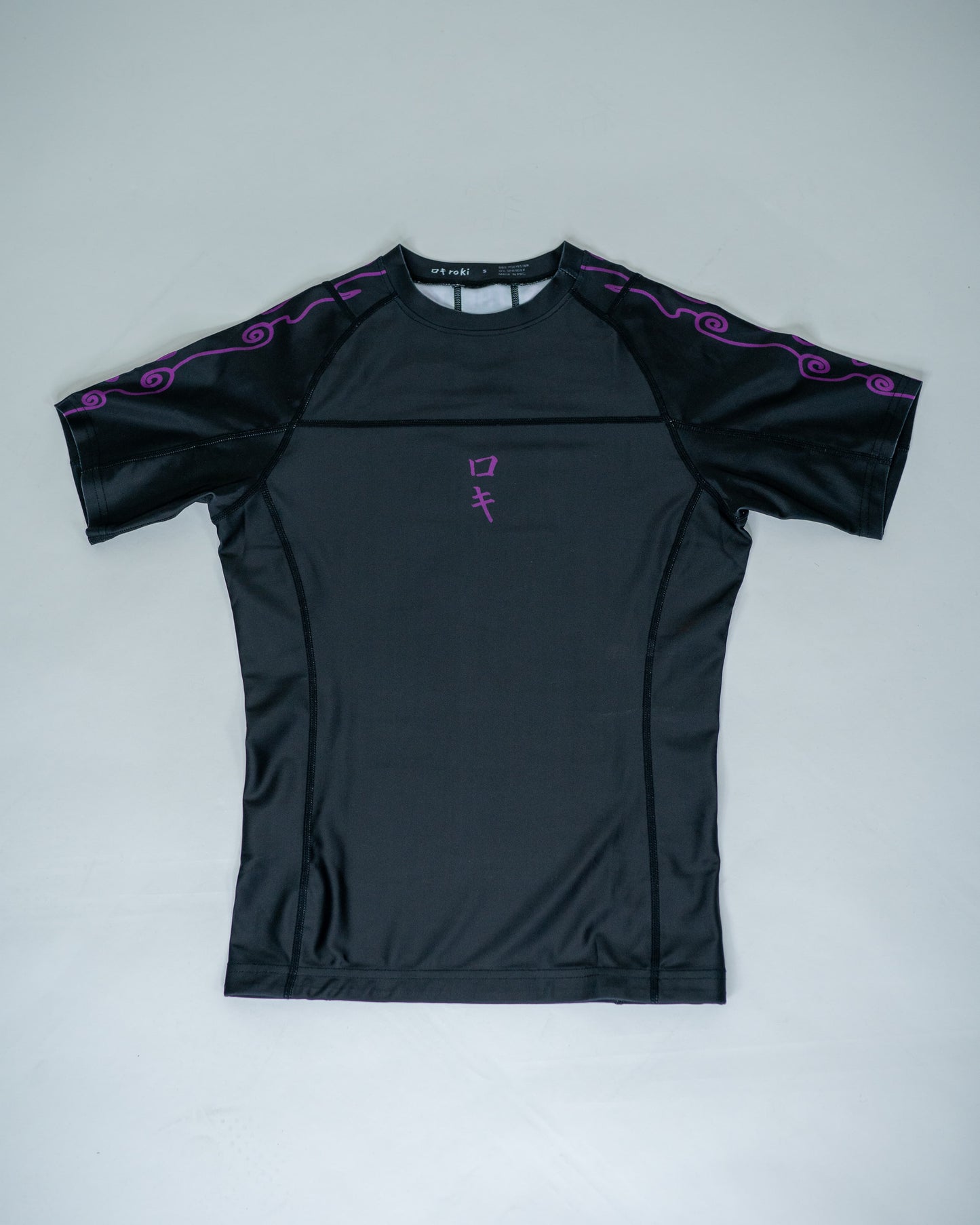 Front view of a black Roki Awakened compression shirt