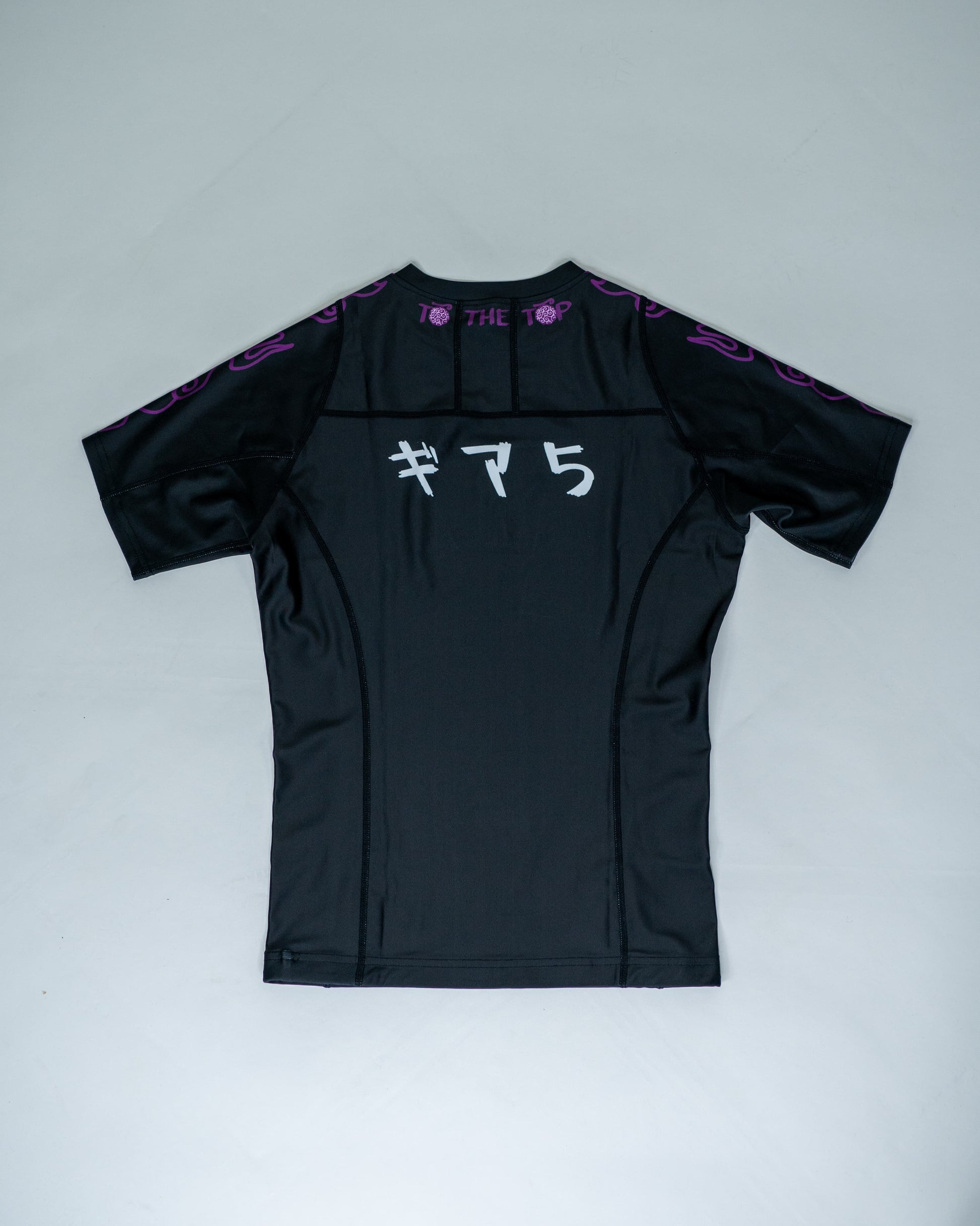 Back view of a black Roki Awakened compression shirt featuring Japanese text