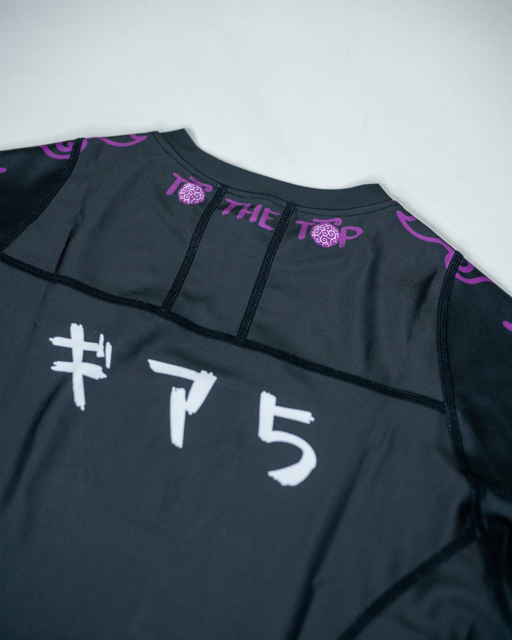 Back close-up of a black Roki Awakened compression shirt