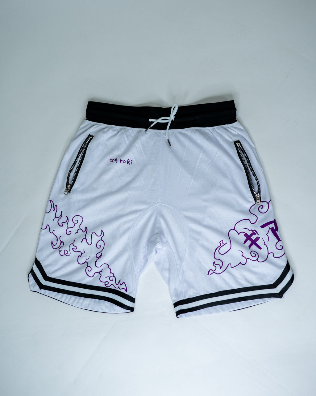 Front view of white Roki Awakened gym shorts featuring purple accents and Roki logo