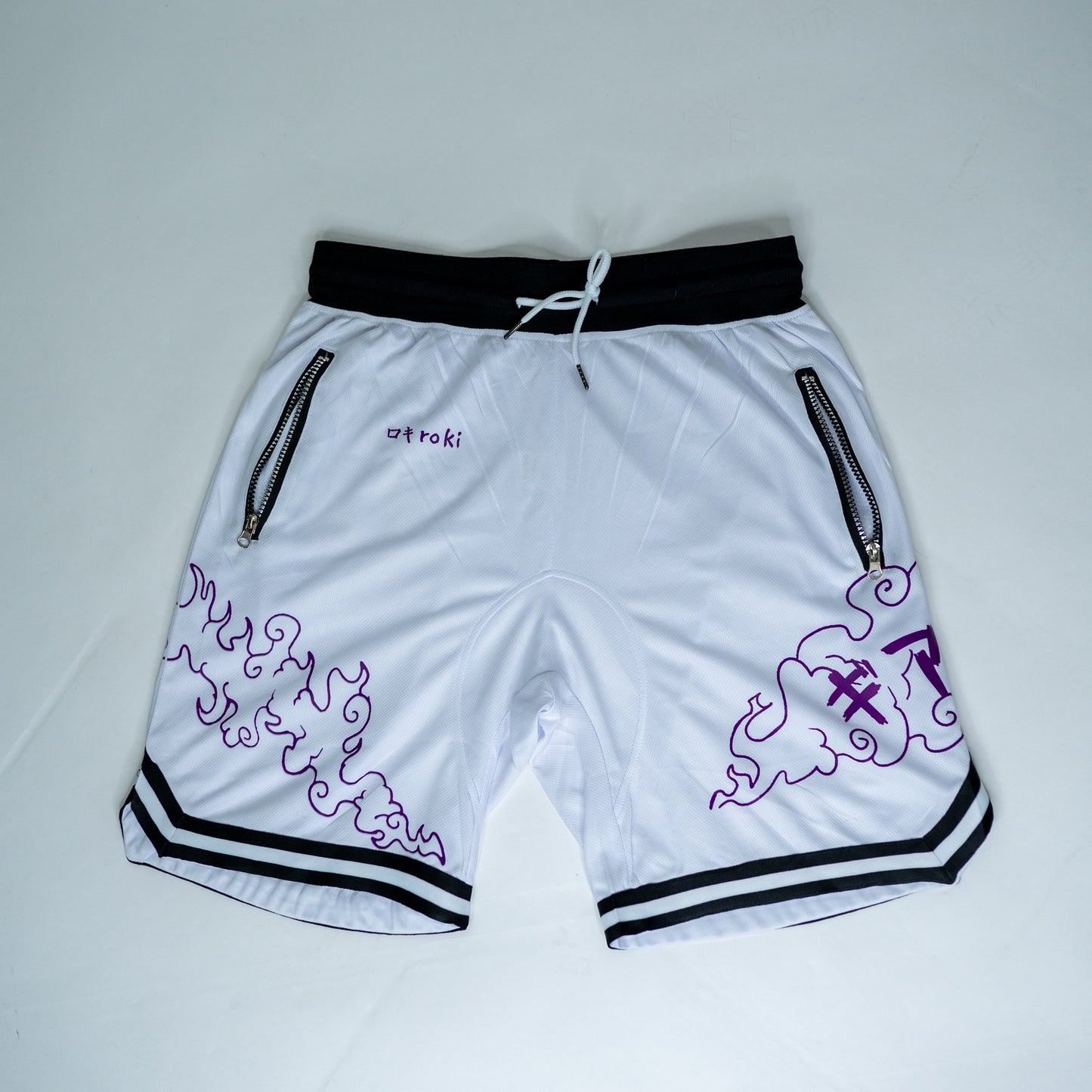 Front view of white Roki Awakened gym shorts featuring purple accents and Roki logo