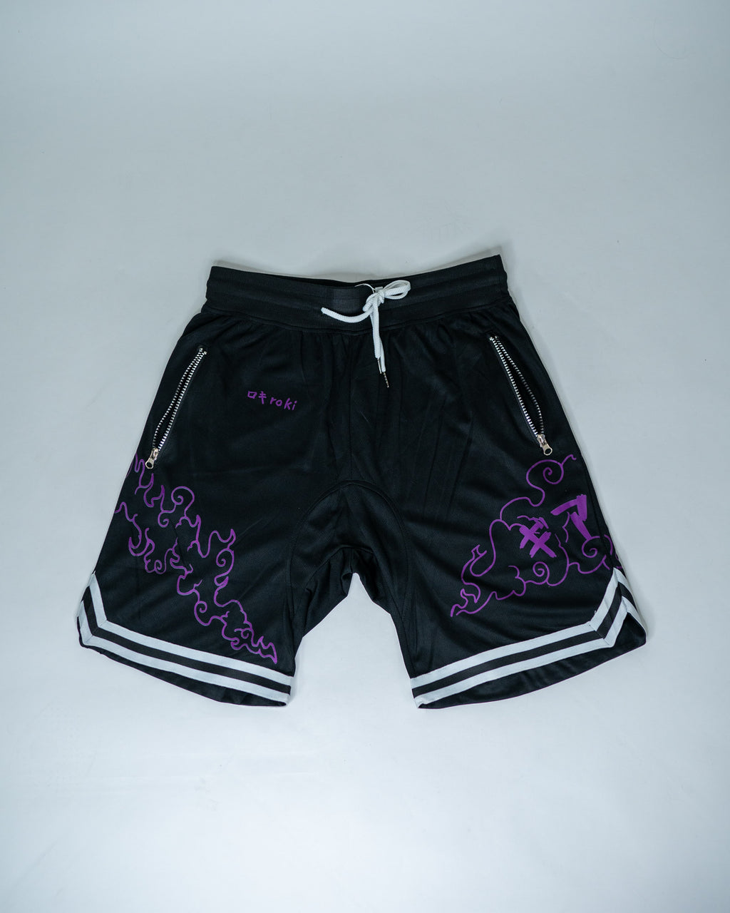 Front view of black Roki Awakened gym shorts featuring purple accents and Roki logo