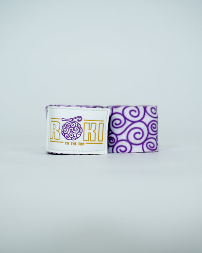 Roki gomu hand wraps rolled up, featuring purple accents, roki logo, thumb-loop and velcro patch