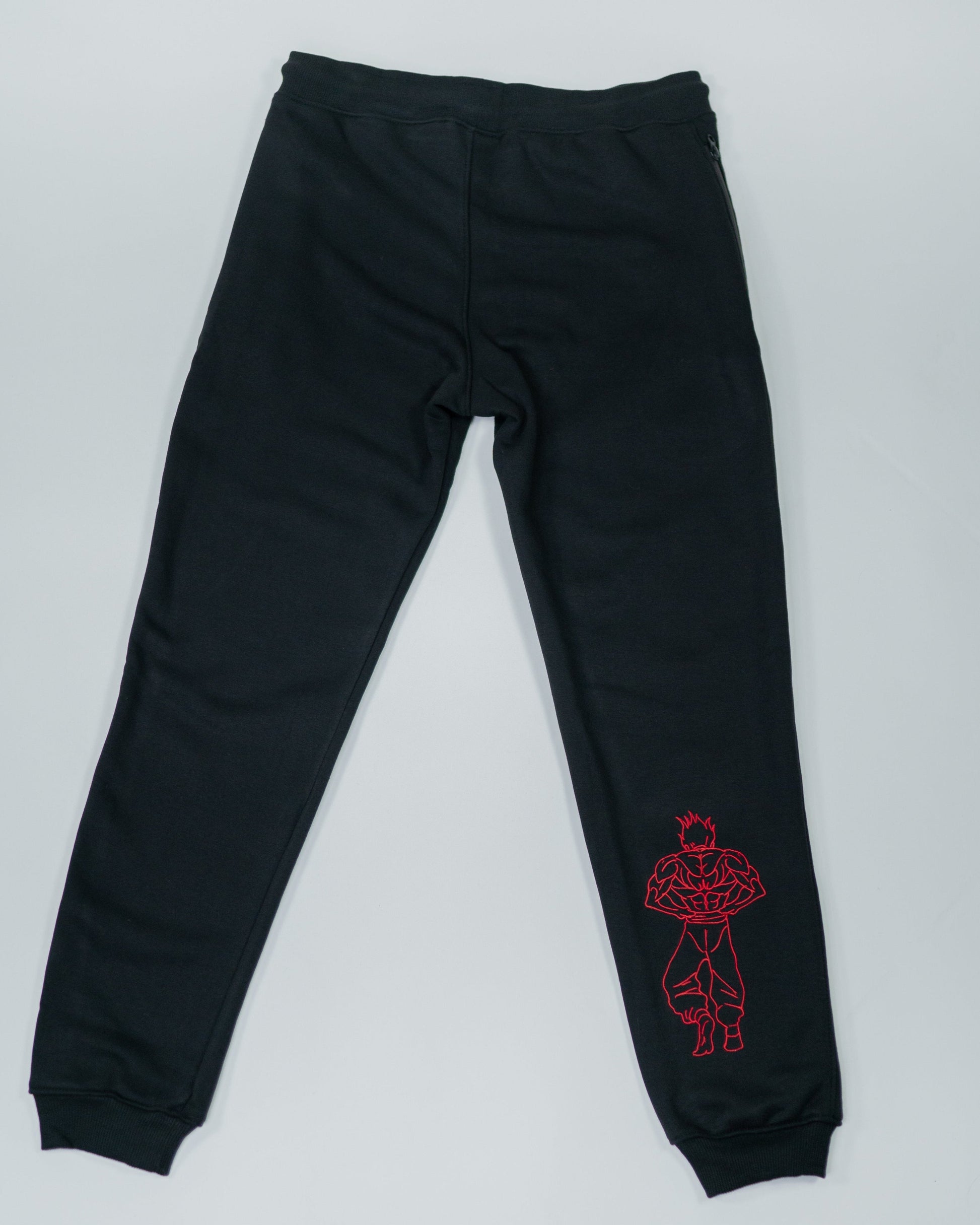 Flatlay of Grappler Joggers back view showing red embroidered demon back character on lower leg