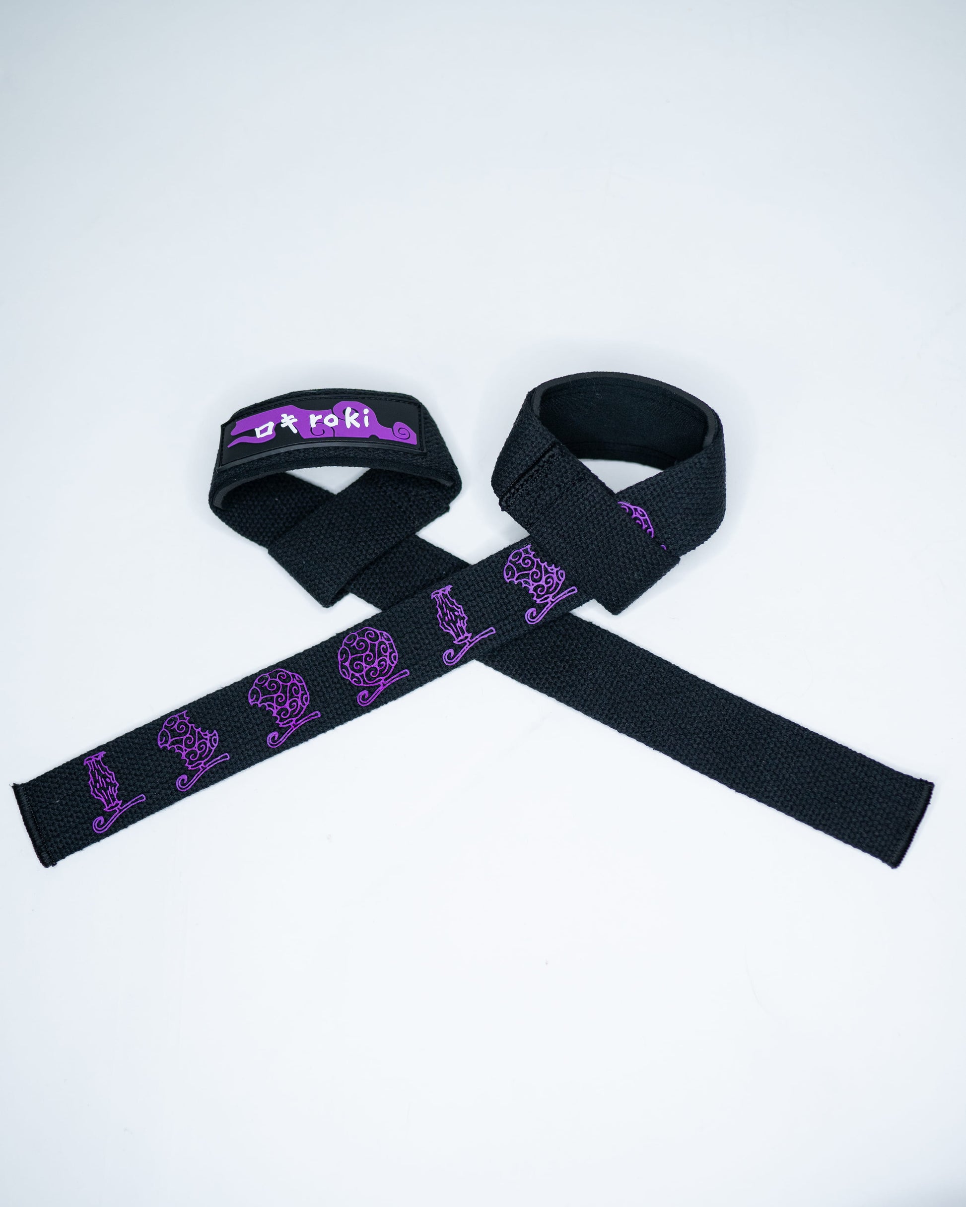 Close-up of black Roki fruit lifting straps featuring purple accents