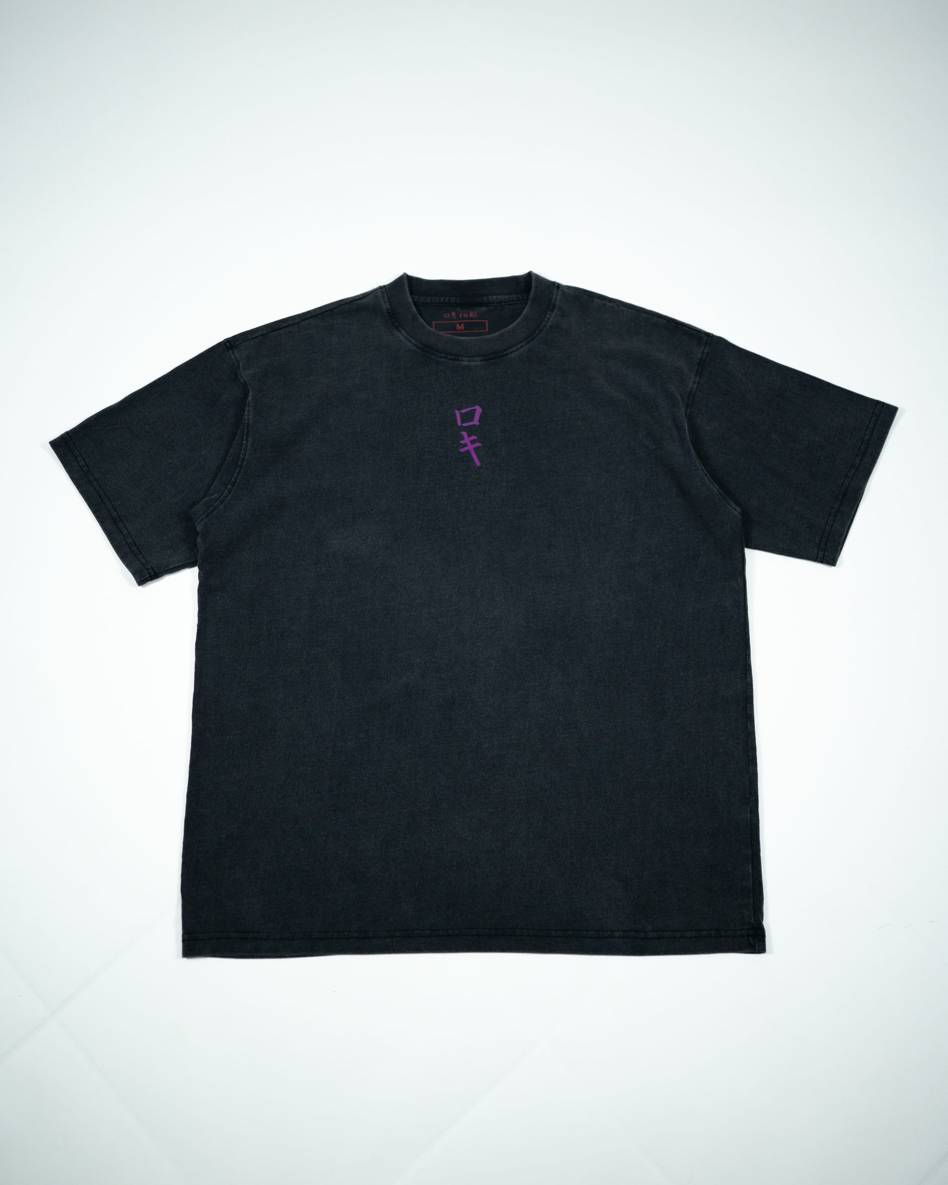 Front view of a black Roki muki muki oversized t-shirt featuring a purple Roki logo