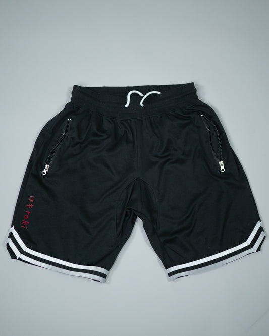 Roki Gym Shorts in black with white trim – lightweight, quick-dry, zipped pockets, and 4-way stretch for gym training