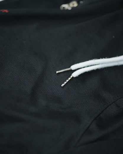 Close-up of white drawstrings and textured waistband on Roki Gym Short
