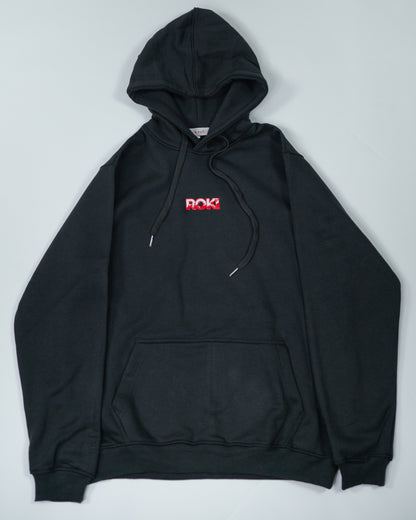 Flatlay of Sekai Saikyo Hoodie showing front view with red ROKI logo on chest and kangaroo pocket