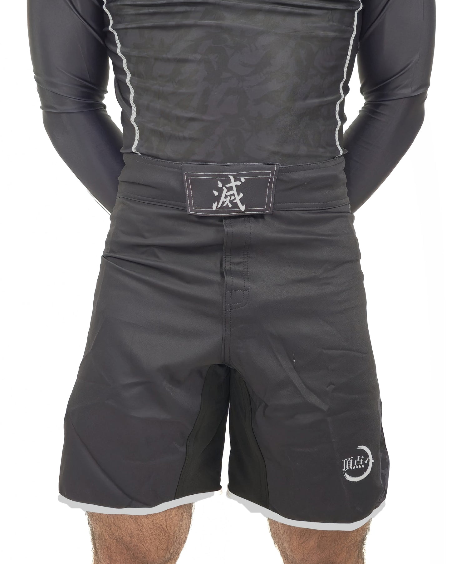 Black mma shorts with a belt and visible brand logo on a white background, demon slayer style