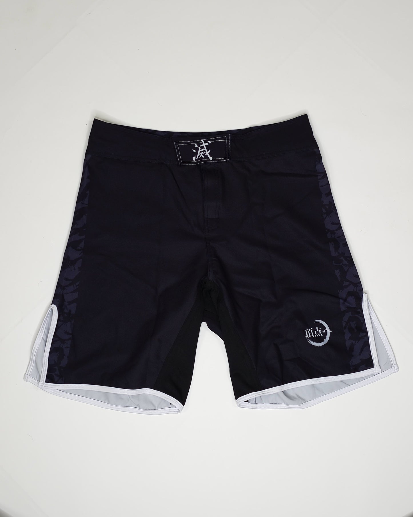 Demon slayer mma shorts product shot, black with white and grey accents.