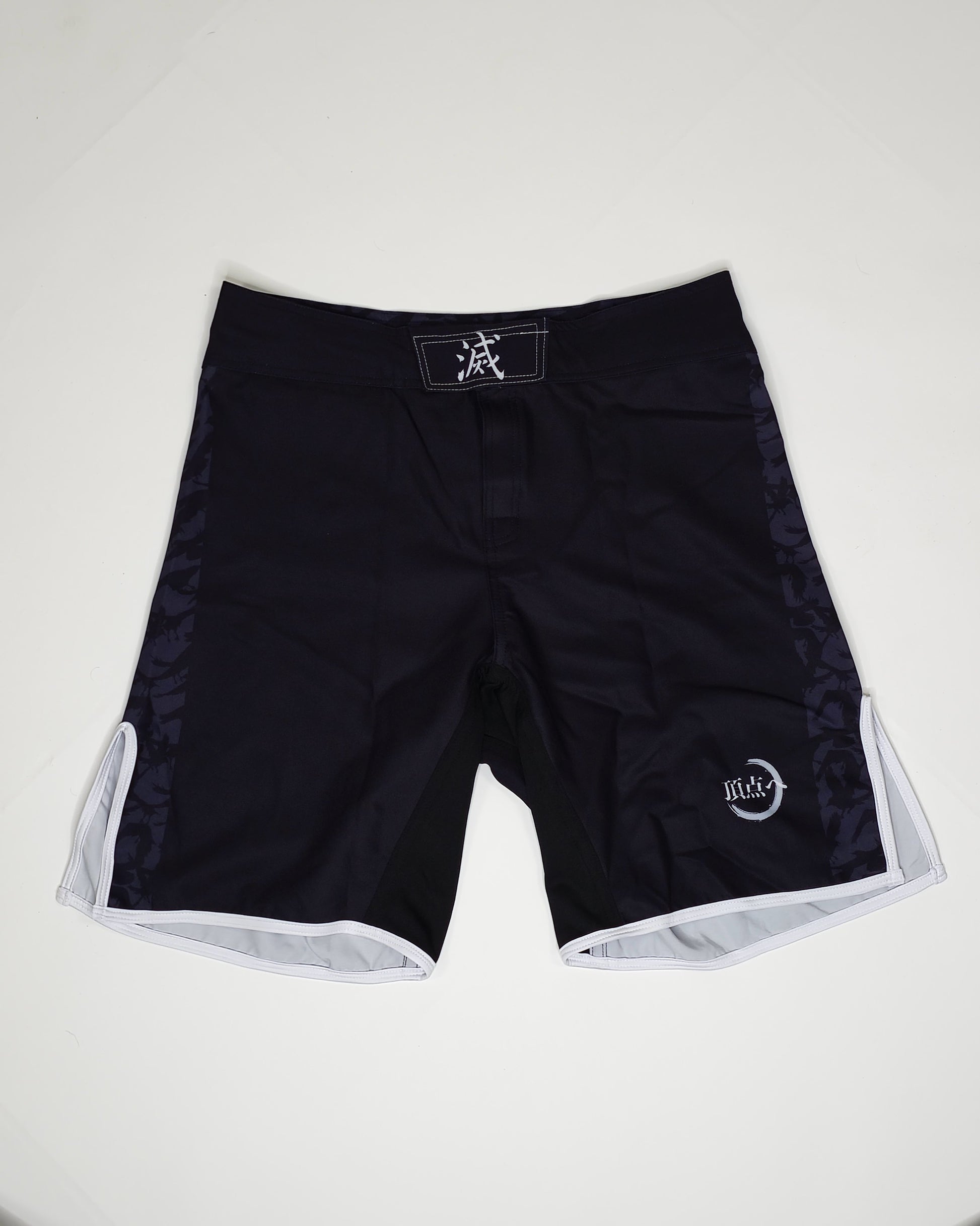 Demon slayer mma shorts product shot, black with white and grey accents.