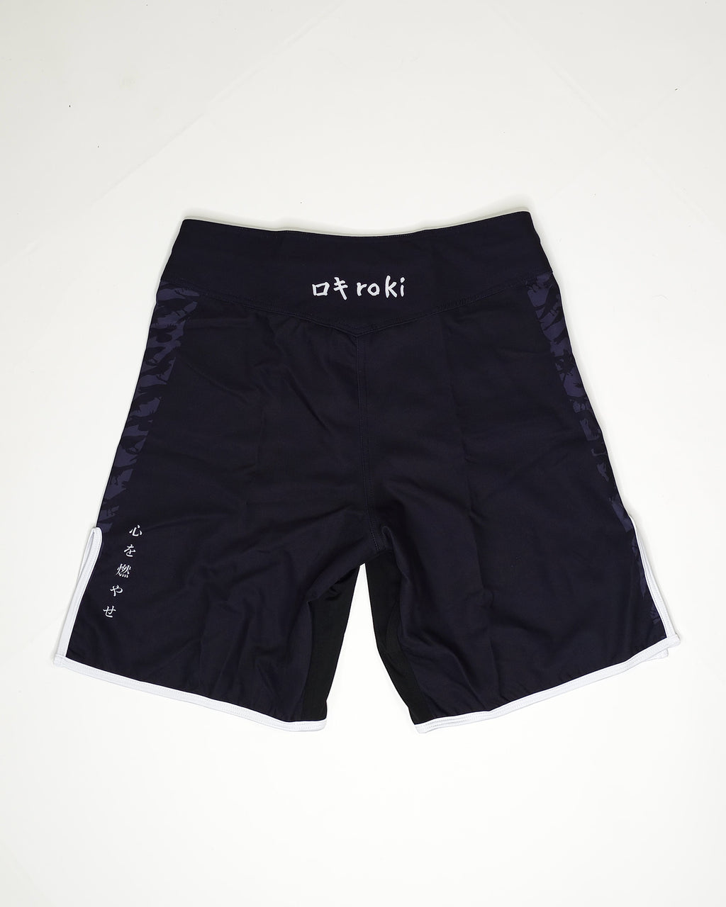 Black shorts with 'Roki' branding on a white background