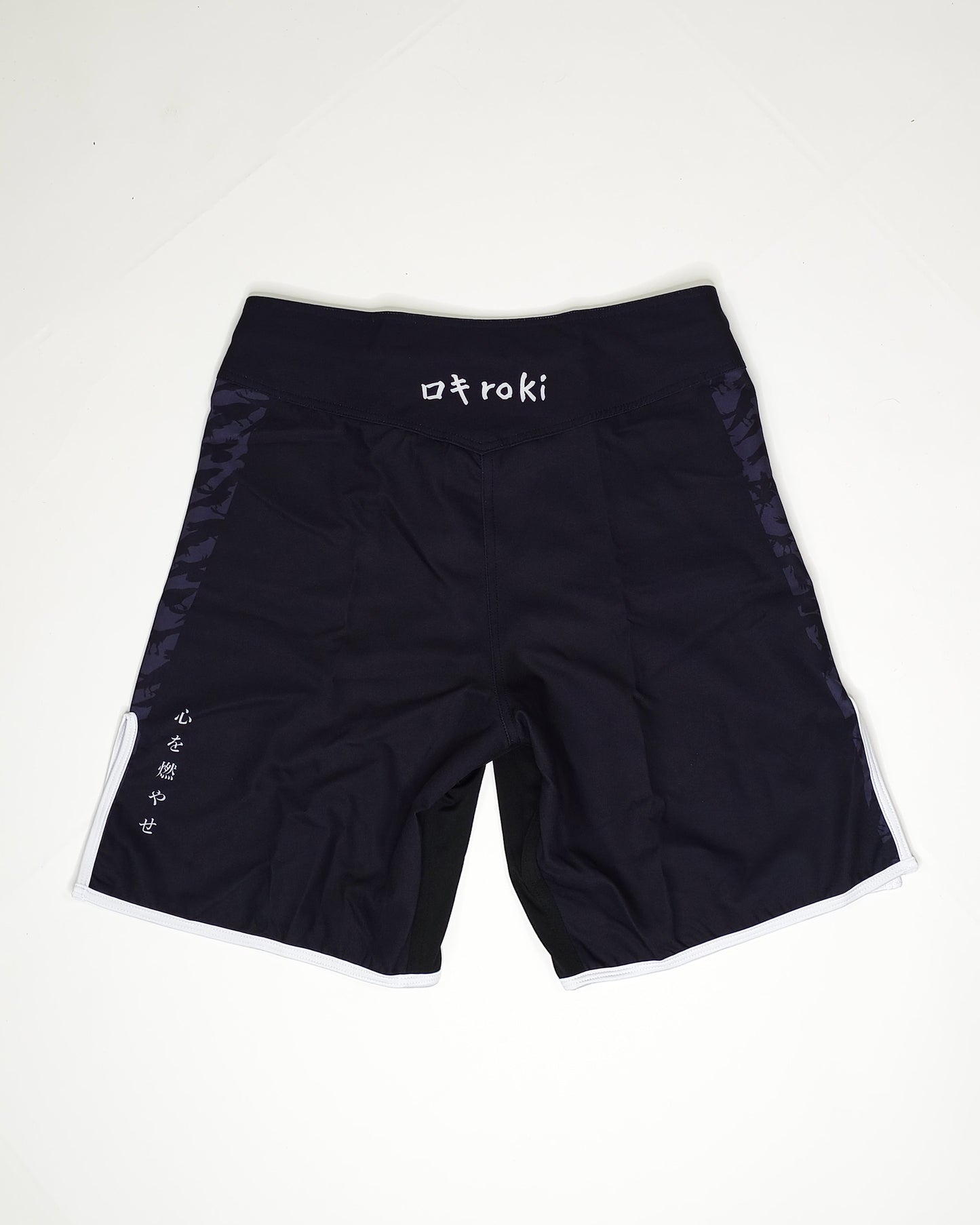Black shorts with 'Roki' branding on a white background