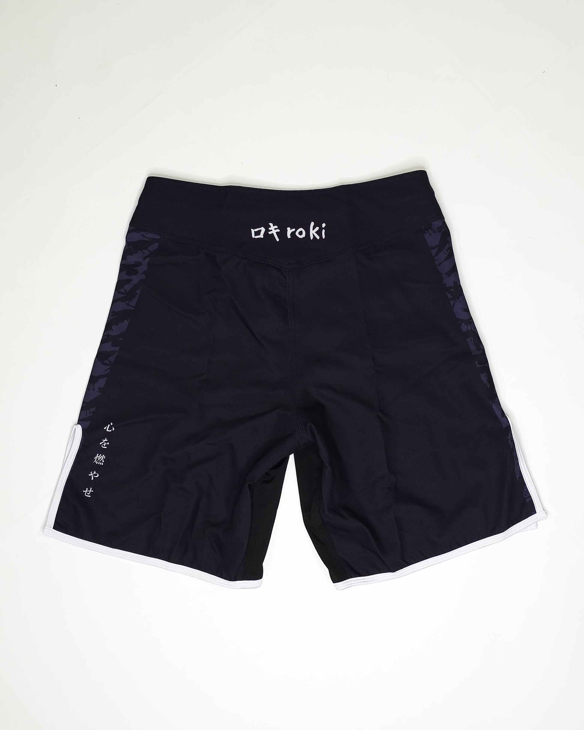 Black shorts with 'Roki' branding on a white background