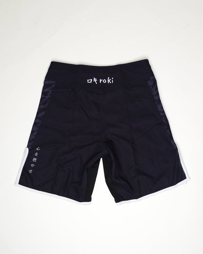 Black shorts with 'Roki' branding on a white background